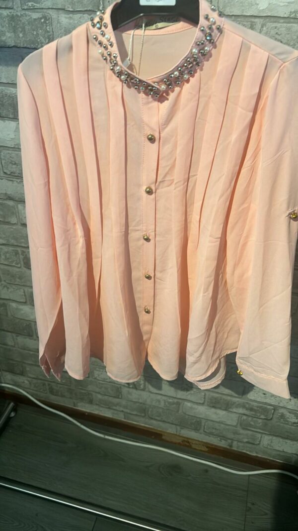 Roze blouse met leuke stuts